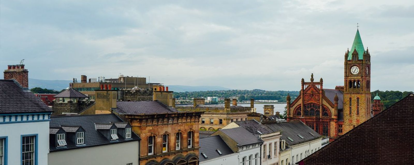The Guildhall clock tower and the city roofs of Derry