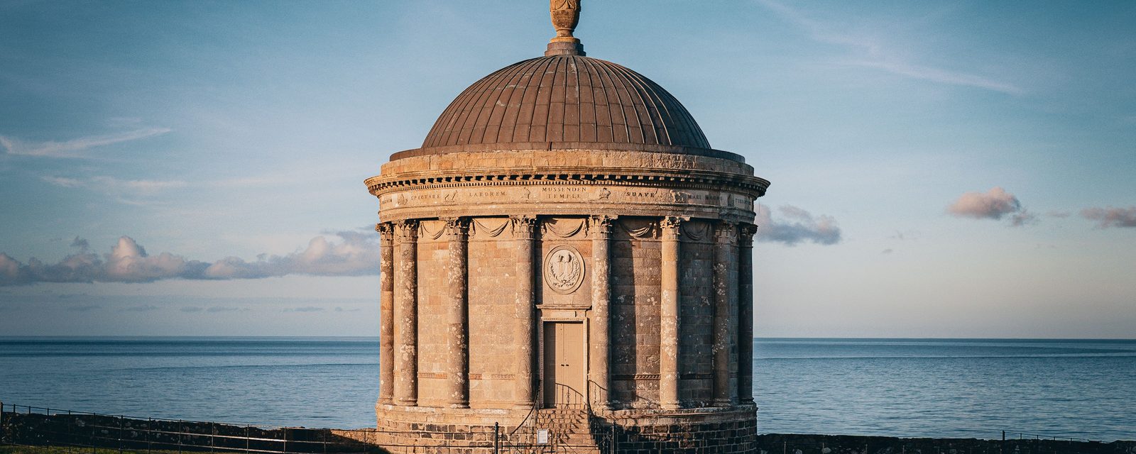 Mussenden Temple on the cliff edge at Downhill, with the sea behind it